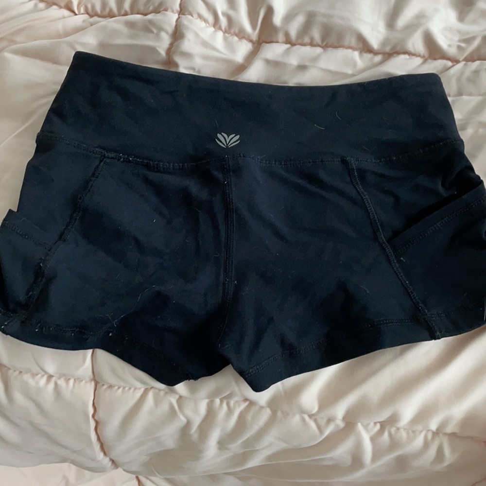 Two active wear shorts in colors black and gray